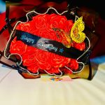 happy birthday banner + red satin rose + butterfly, + black and white pearl wrap + tiny black bows